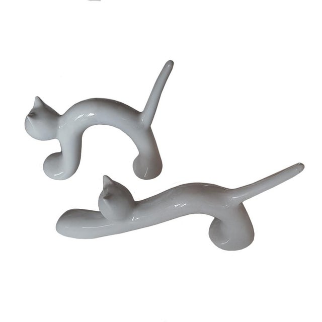 Cat figurines produced by naaman israel in the 1970s. dimensions: cat 1 h: 12,5 cm w: 12 cm d: 3 cm cat 2 h: 9,5 cm w: 18...