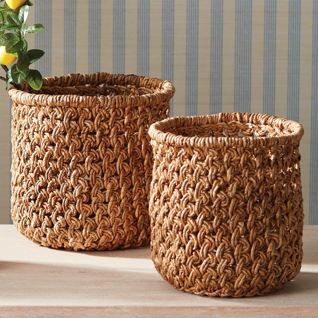 With a unique weave and tall round profile, this set of 2 baskets are firm and substantial. Made of durable banana leaves...
