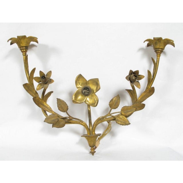 Applique in gilded bronze with five lights each with bayonet connection. French manufacturing. The appliques come from...