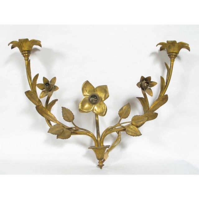 Applique in gilded bronze with five lights each with bayonet connection. French manufacturing. The appliques come from...