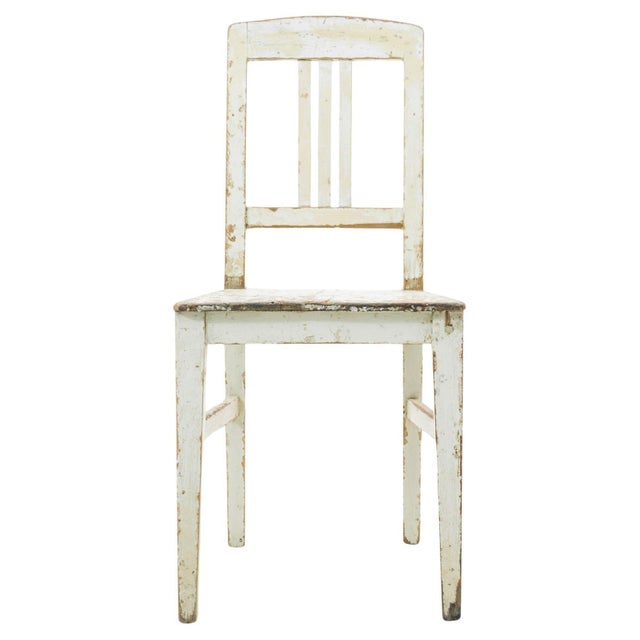 Embrace the authentic vintage charm with this 1910s Czech Wood Patinated Chair. Bearing the beautiful marks of time, its...