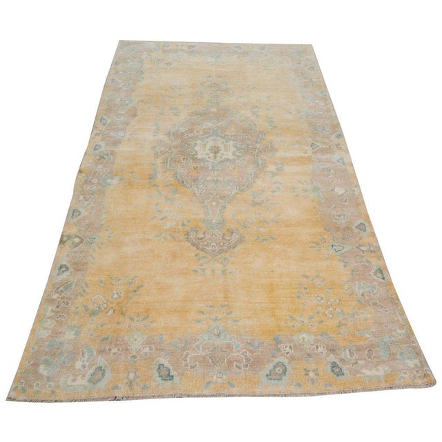 Hand-knotted with care using traditional rug-making techniques, this wool rug blends timeless craftsmanship with a modern...