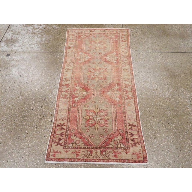 A vintage Turkish Oushak throw rug. In the Caucasian manner, a central teal pole medallion composed of three conjoint...