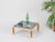 Marvelous coffee table crafted in a refined combination of solid brass and bamboo, completed with a thick smoked glass...