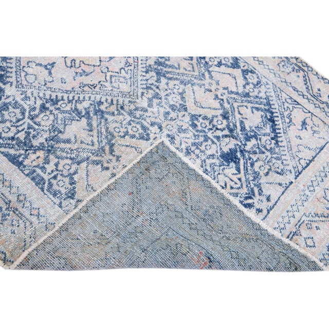 Beautiful vintage Persian Mahal hand-knotted shabby chic wool rug with a navy blue field. This piece has a peach frame...
