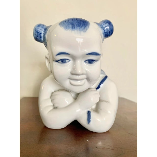 Traditionally used as pillows, this rare ceramic baby figure makes a great decoration for a child’s room or as a stand for...