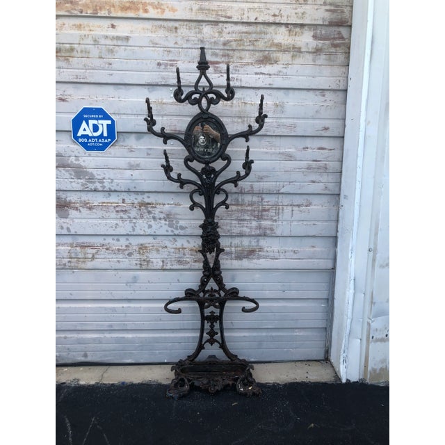 Early 20th Century Six Armed Iron Hall Tree With Small Center Mirror and Two Umbrella Racks and One Large Drip Tray For Sale - Image 9 of 11