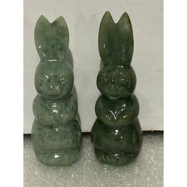 Carved jade bear holding fish, seal, and 2 rabbits. Bear 3” long, rabbit 3.25” tall.