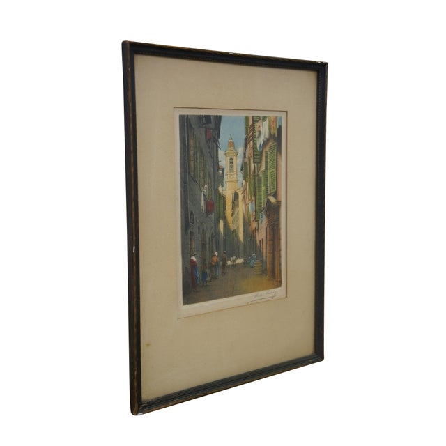 Antique colored etching of a narrow street in the old town of Nice, France by Victor Valery. The scene captures a typical...
