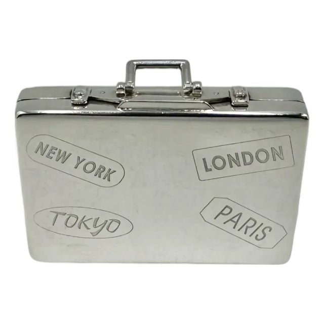 Details: -This charming sterling silver trinket box by Asprey is designed in the shape of a miniature suitcase -Features...