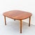 An uncommon walnut dining table with two leaf extensions by Dux, made in Sweden c. 1960s with design attributed to Folke...