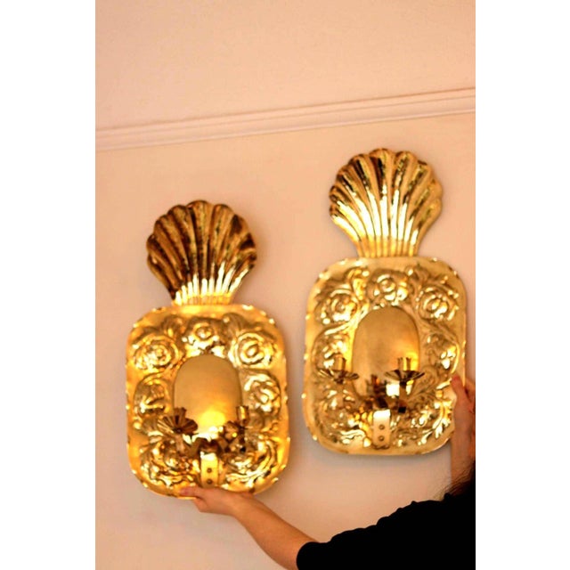 A striking pair of vintage brass wall sconces, signed t. Rundqvist. crafted in the 1960s–70s, these sculptural pieces were...