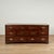 Chic mid century dresser crafted in mahogany with seven drawers uniquely off set, campaign style brass hardware and block...