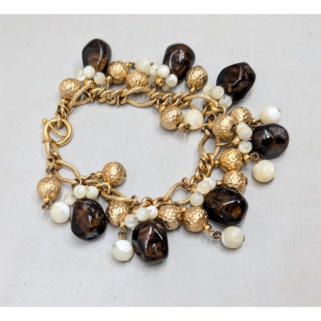 Mid-Century Modern Vintage 1960s Signed Napier Goldtone Faux-Topaz & Mother of Pearl Charm Bracelet For Sale - Image 3 of 14