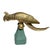 A large Hollywood Regency brass Cockatoo bird sculpture on a green wood base. This piece is lifesize and in wonderful...