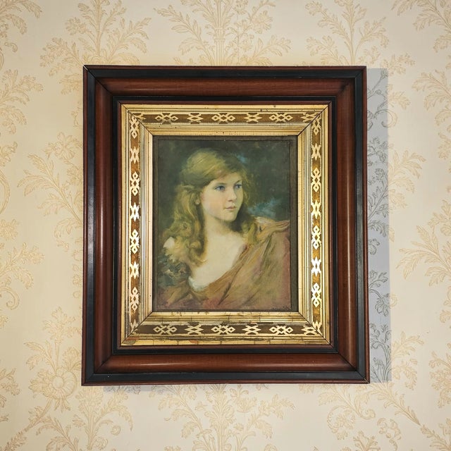 An American Aesthetic Movement frame, circa 1900, executed in solid walnut with a geometric gilt gesso liner. The bold...
