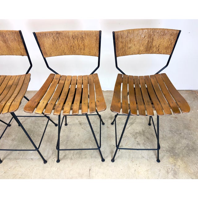 Extraordinary set of four c. 1960’s Arthur Umanoff designed for Raymor tall bar stools (unsigned). Umanoff-designed iron...