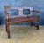 Spanish Renaissance Revival bench crafted in solid oak, Early 20th century. The bench features a paneled backrest with...