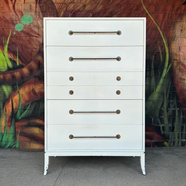 This is an absolutely stunning Tommi Parzinger for Parzinger Originals tall dresser. There are six compartmentalized...
