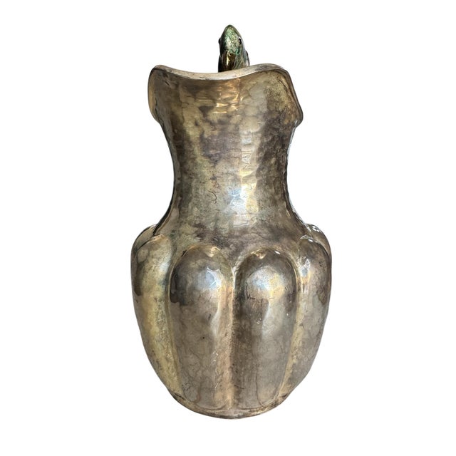 Striking mid-20th century silver plate pitcher by Los Castillo, showcasing the workshop’s iconic blend of refined...