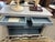 A charming 19th Century French Provincial two-door buffet, featuring a classic Louis XV-influenced silhouette. This piece...