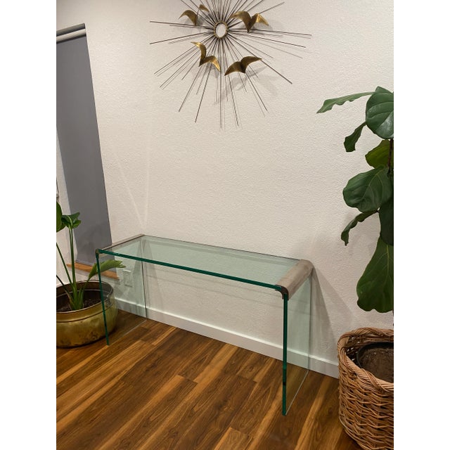 Chrome and Glass Waterfall Console Table attributed to Leon Rosen for Pace Collection. A timeless piece that is simple,...