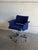 This office desk chair features a supportive backrest and integrated armrests. The design offers smooth swivel mobility on...