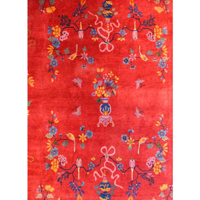 An incredible early 20th century Chinese Art Deco rug with a rich crimson field surrounded by a thin gold inner border and...