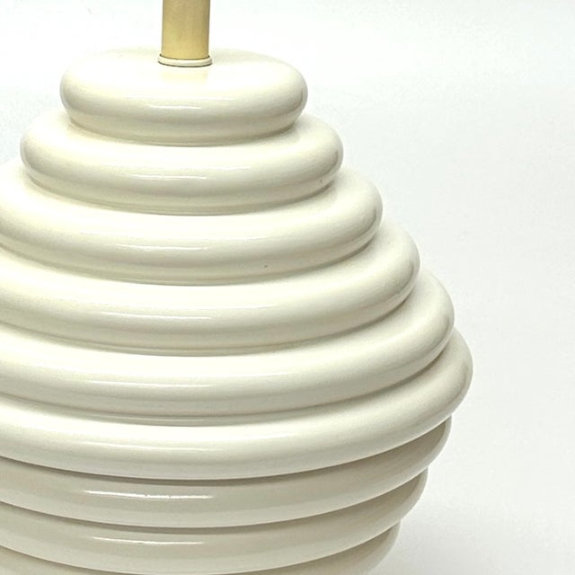 This stunning cream ceramic beehive lamp dates to the mid-to-late 20th century and makes a bold statement in any space. A...