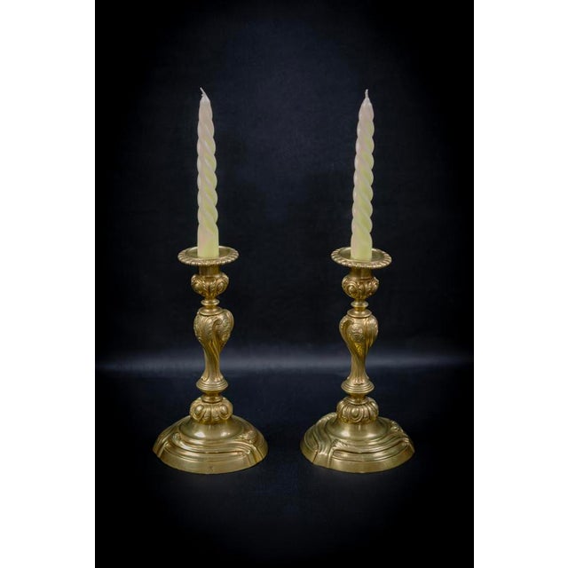 The design of these candlesticks follows the tradition of re-editions of the french rococo style, very popular throughout...