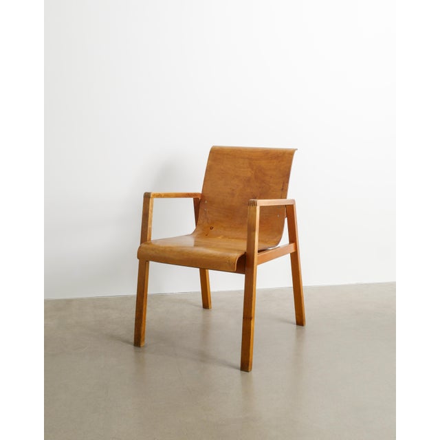 A very rare and early finnish mid century wooden "no 51 / hallway" armchair in form pressed laminated plywood and birch by...