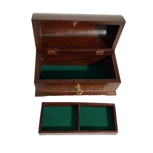 Solid Wooden and delicate brass inlay handicraft Jewelry Domed Box with royal Rajasthani look. It showcases the rich art...