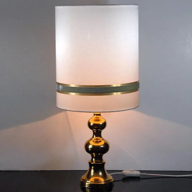 - Table lamp on a gilded porcelain base designed in Space Age style - Original lampshade - The lamp comes from Germany...
