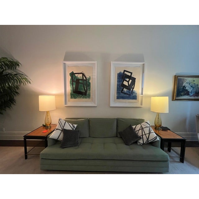 Custom sofa upholstered in a refined muted sage green fabric by Zimmer + Rohde, with subtle tonal variation, commissioned...