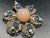 MCM stamped filigree frame and a distinct Bohemian art glass center. While often casually labeled as "Dragon's Breath" by...