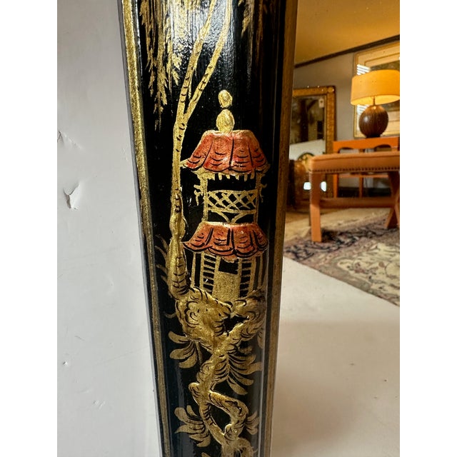 Lovely large ebonized hand painted & gilded chinoiserie wall mirror having scalloped top and beautiful figural details.