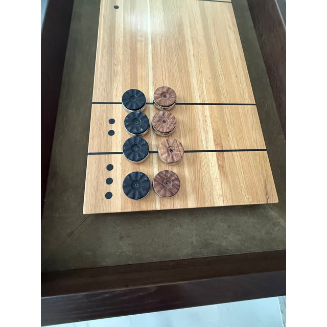 This 13-foot long shuffleboard table by District Eight is a unique combination of quality materials and skilled...