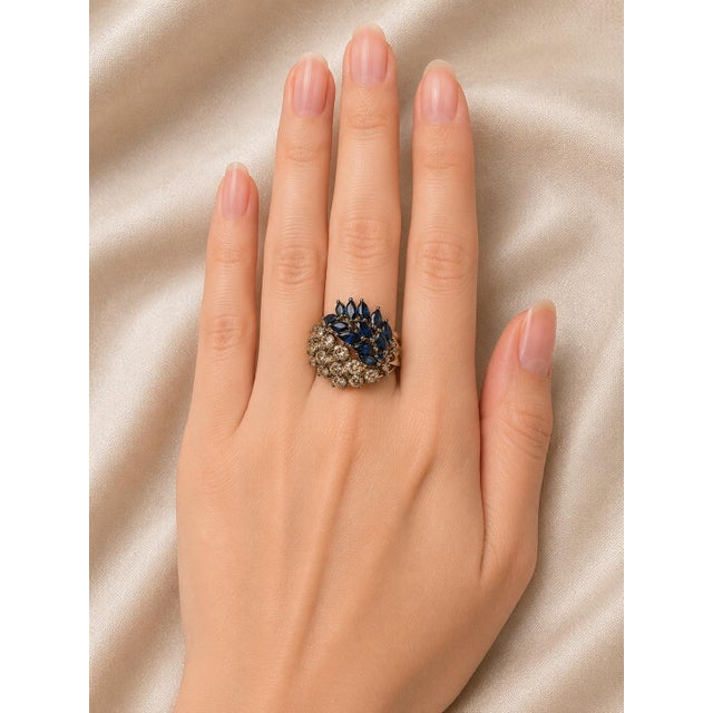 18K white and blackened gold designer ring featuring brilliant round champagne diamonds and natural sapphires in a bold...