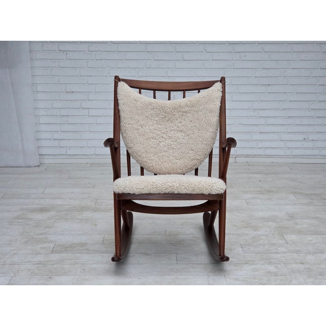 1960s, Danish rocking chair by Frank Reenskaug, model 182. Reupholstered in quality genuine sheepskin from New...