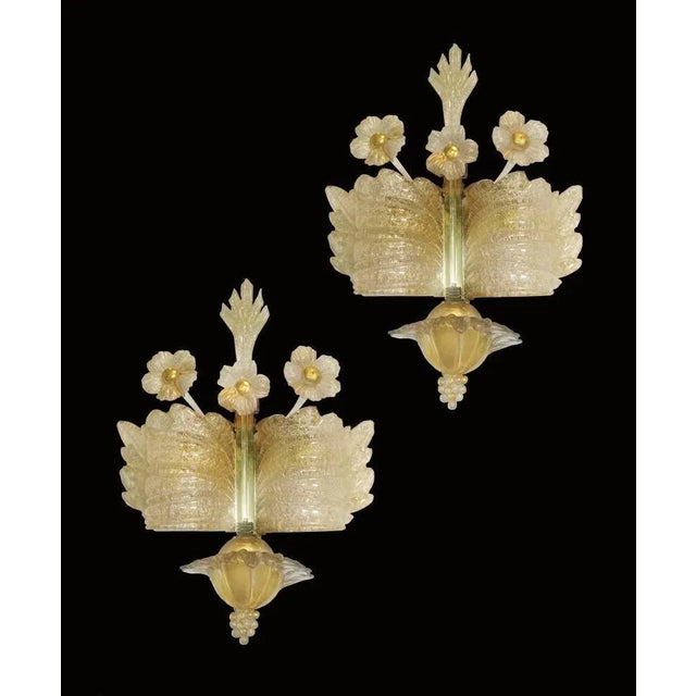 Gorgeous Trio of sconces 24-karat gold by Barovier & Toso. Measures: The big one 105 cm height, 12 cm depth, width 35 cm...