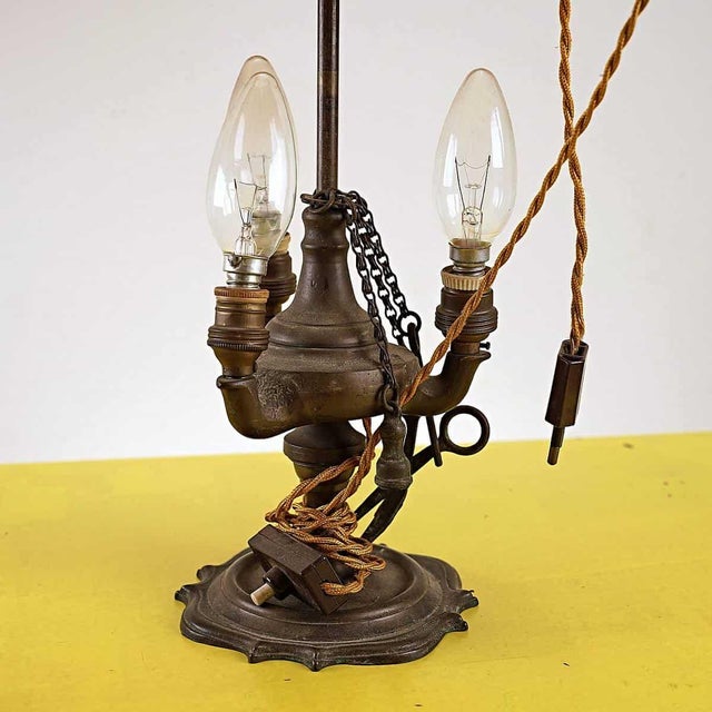 Florentine table lamp with three lights Height: 53 Diameter: 25 This piece is attributed to the mentioned designer/maker....