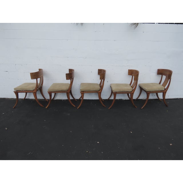 This high quality Set of 5 Chairs is made out of solid wood with an exotic finish. The set has a classic Mid Century...