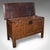 This is an antique coffer. An English, carved oak three panel linen chest or bay window seat, dating to the early Georgian...
