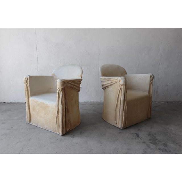 We just love this pair of sculptural pair of Trompe-l'oeil draped plaster and fiberglass chairs. They have been finished...