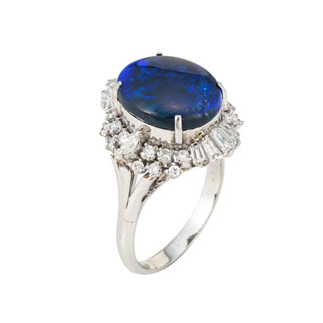 This is part of Chairish's Fine Jewelry assortment. Stylish 4.58ct natural black opal & diamond cocktail ring crafted in...
