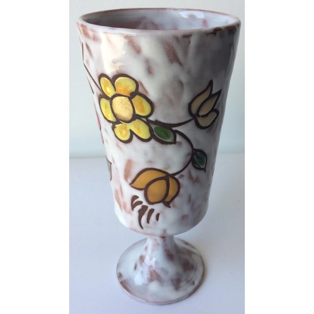 Handcrafted, hand painted French midcentury ceramic vase. Beautifully decorated with floral designs and glazed. Signed on...