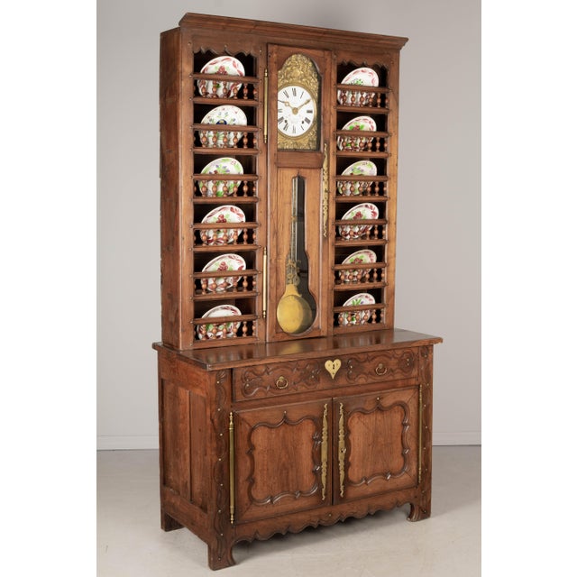 A 19th Century Country French vaisselier, or china hutch, from Brittany made of solid chestnut and in two parts. The top...
