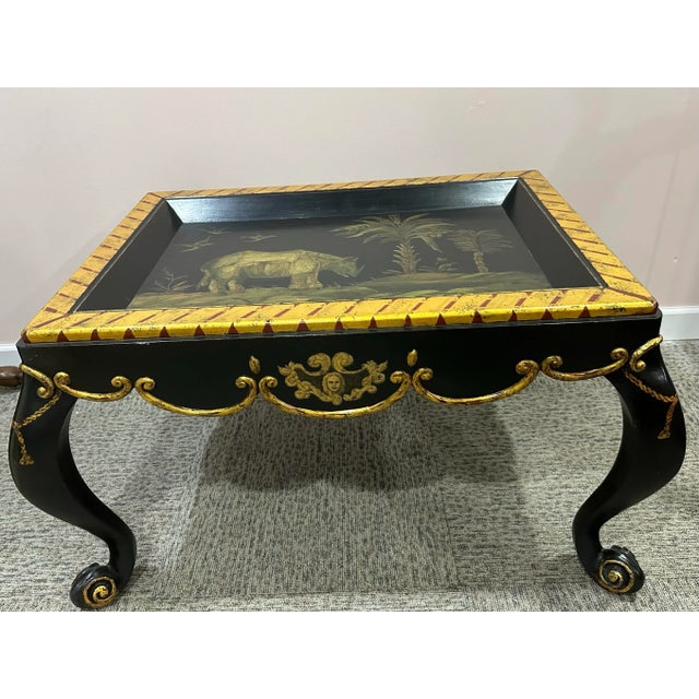 Striking Italian Louis XV style ebonized and gold gilt coffee table . Rectangular shape, hand painted rhinoceros and plant...