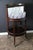 This English bar cabinet is particularly unusual and elegant. Dating from the 1920s, its drinks compartment flips open to...