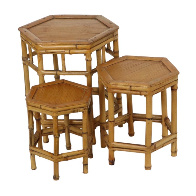 A beautiful vintage set of three bamboo and rattan side tables, coffee tables, or plant stands. This highly decorative set...